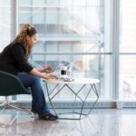 Woman Sitting on Blue and Gray Chair