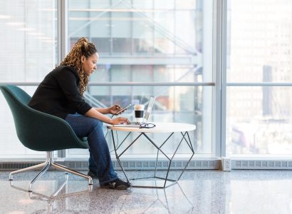 Woman Sitting on Blue and Gray Chair